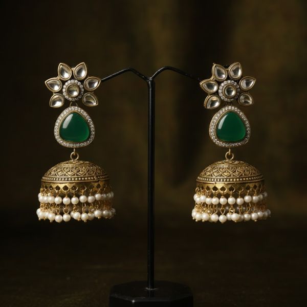Vintage Gold-Plated Jhumka Earrings with Green Gemstone and Pearl Tassels