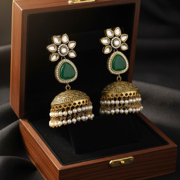 Vintage Gold-Plated Jhumka Earrings with Green Gemstone and Pearl Tassels